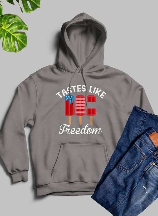 A stylish Tastes Like Freedom Hoodie featuring unique artistic designs, made from cozy fleece blend material with an adjustable hood.