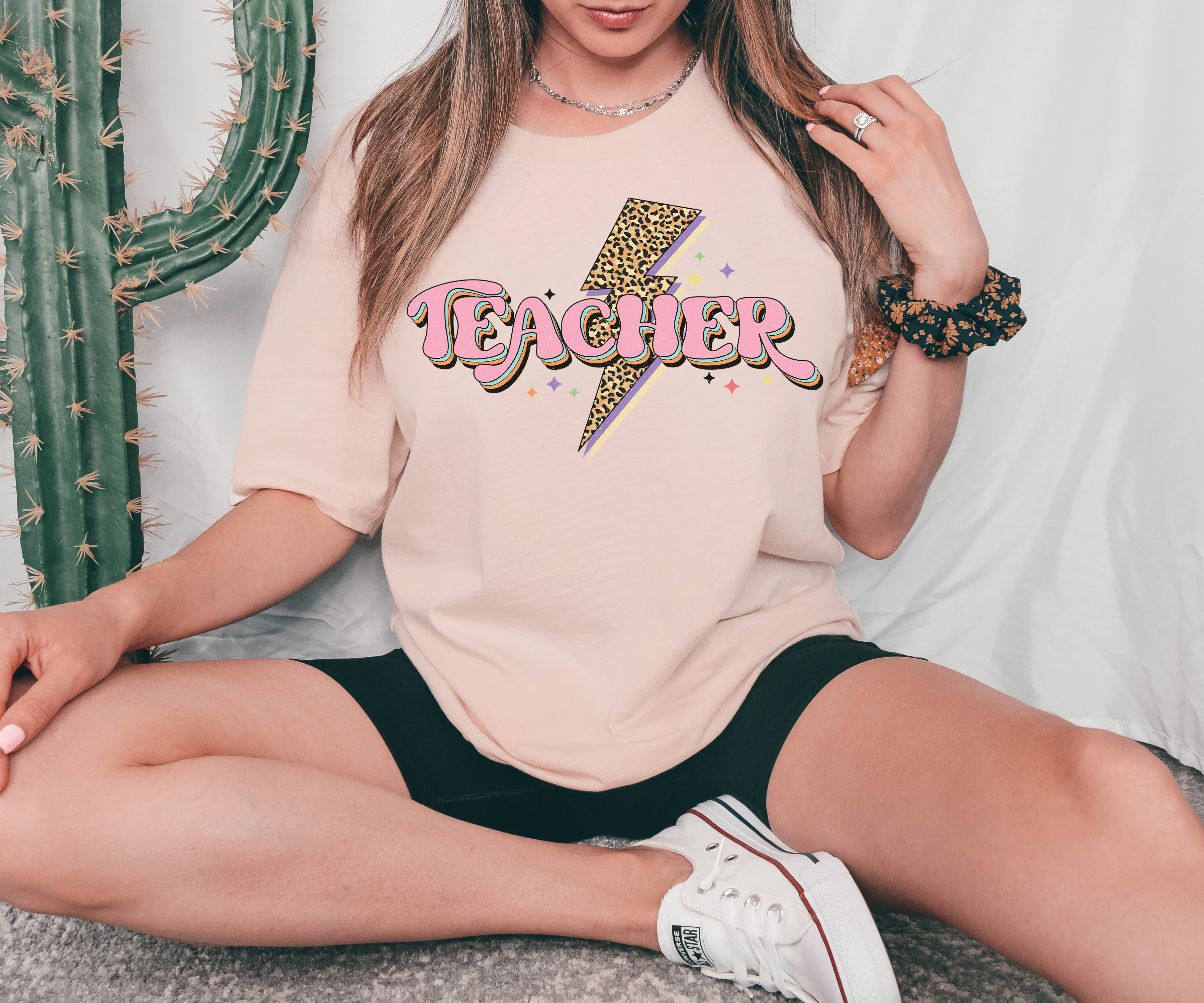 A stylish Teacher T-shirt made from premium ring spun cotton, featuring a vibrant flex print design, available in various sizes.