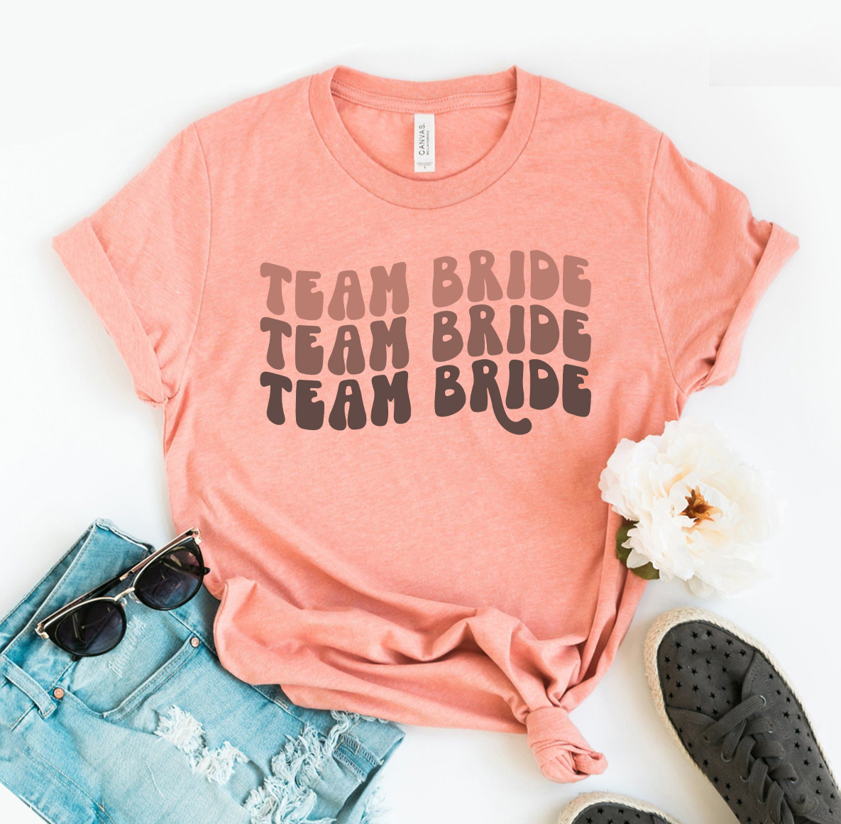 Team Bride T-shirt made of premium ring spun cotton, featuring a soft feel and high-quality flex print design, available in various sizes.