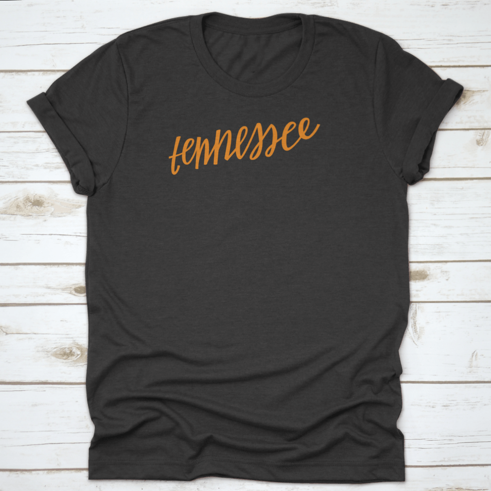 A trendy Tennessee State Outline T-Shirt featuring hand-lettering design, made from soft cotton fabric.