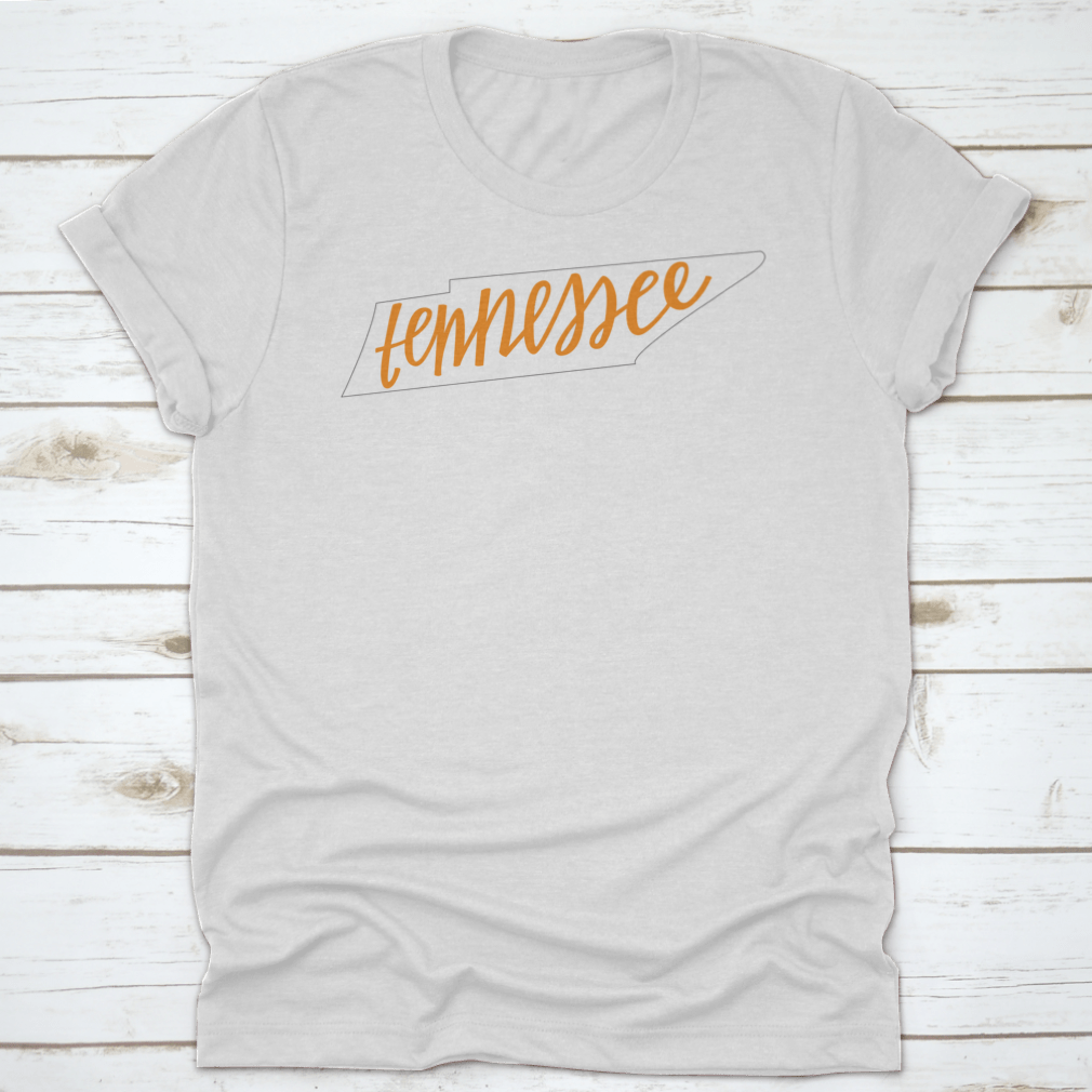 A trendy Tennessee State Outline T-Shirt featuring hand-lettering design, made from soft cotton fabric.