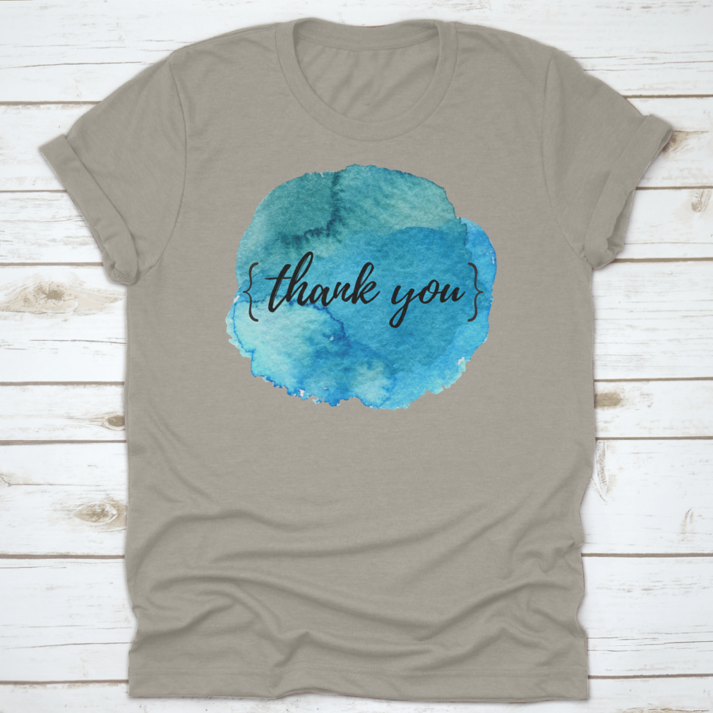 A stylish cotton t-shirt featuring a watercolor circle spot design with an inspirational quote, perfect for motivation.