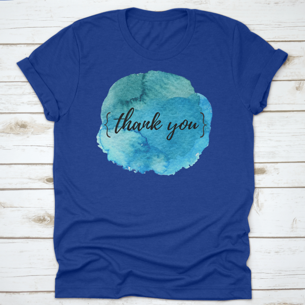 A stylish cotton t-shirt featuring a watercolor circle spot design with an inspirational quote, perfect for motivation.