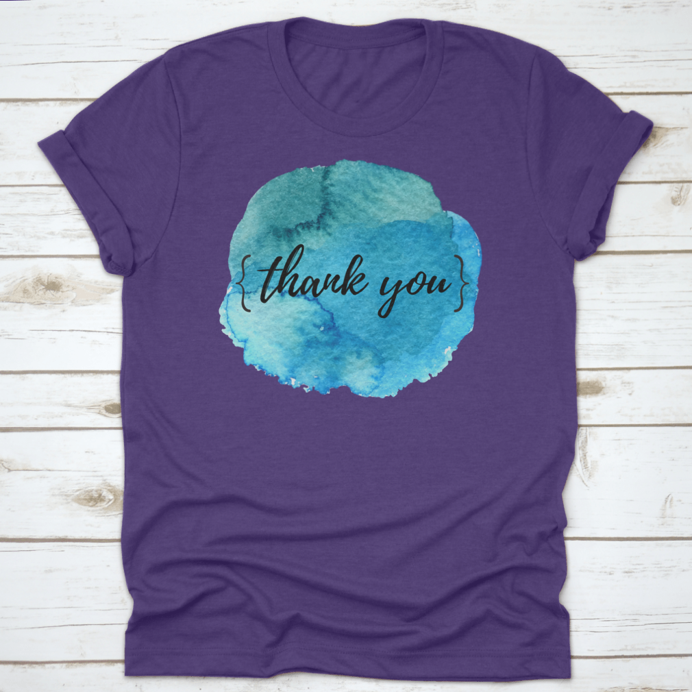 A stylish cotton t-shirt featuring a watercolor circle spot design with an inspirational quote, perfect for motivation.