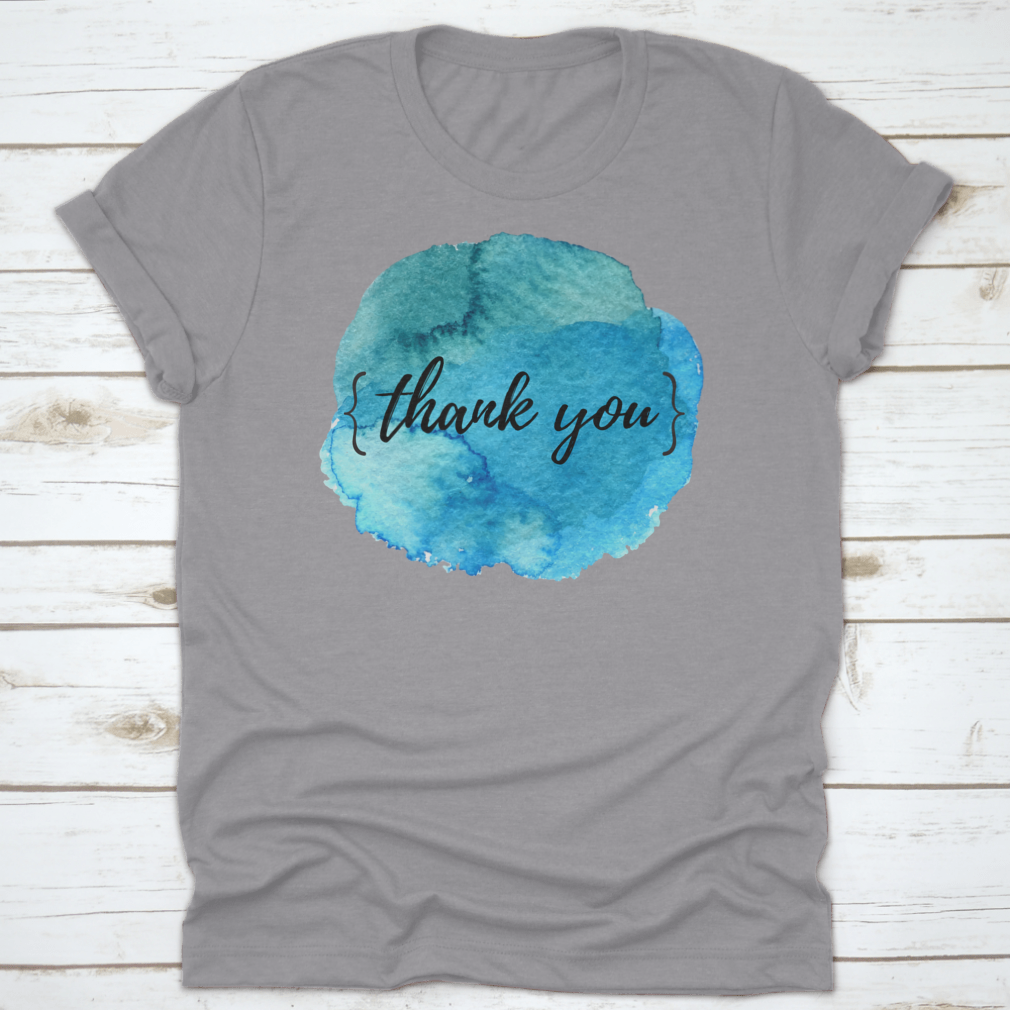 A stylish cotton t-shirt featuring a watercolor circle spot design with an inspirational quote, perfect for motivation.