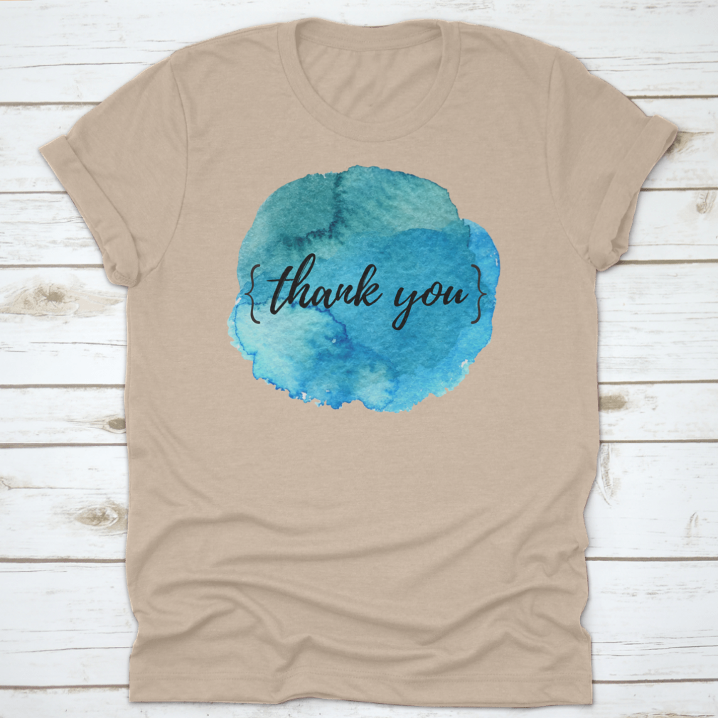 A stylish cotton t-shirt featuring a watercolor circle spot design with an inspirational quote, perfect for motivation.