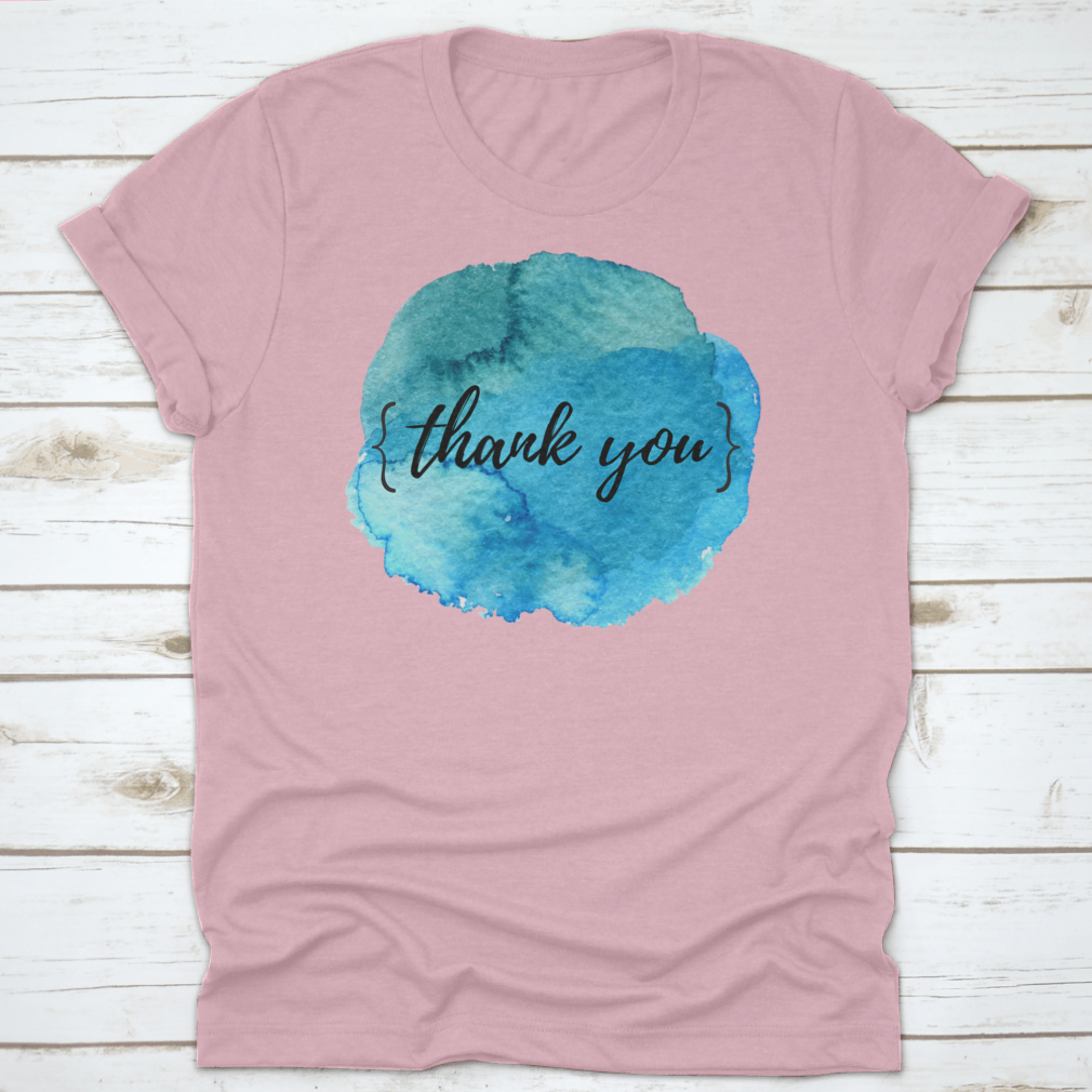 A stylish cotton t-shirt featuring a watercolor circle spot design with an inspirational quote, perfect for motivation.