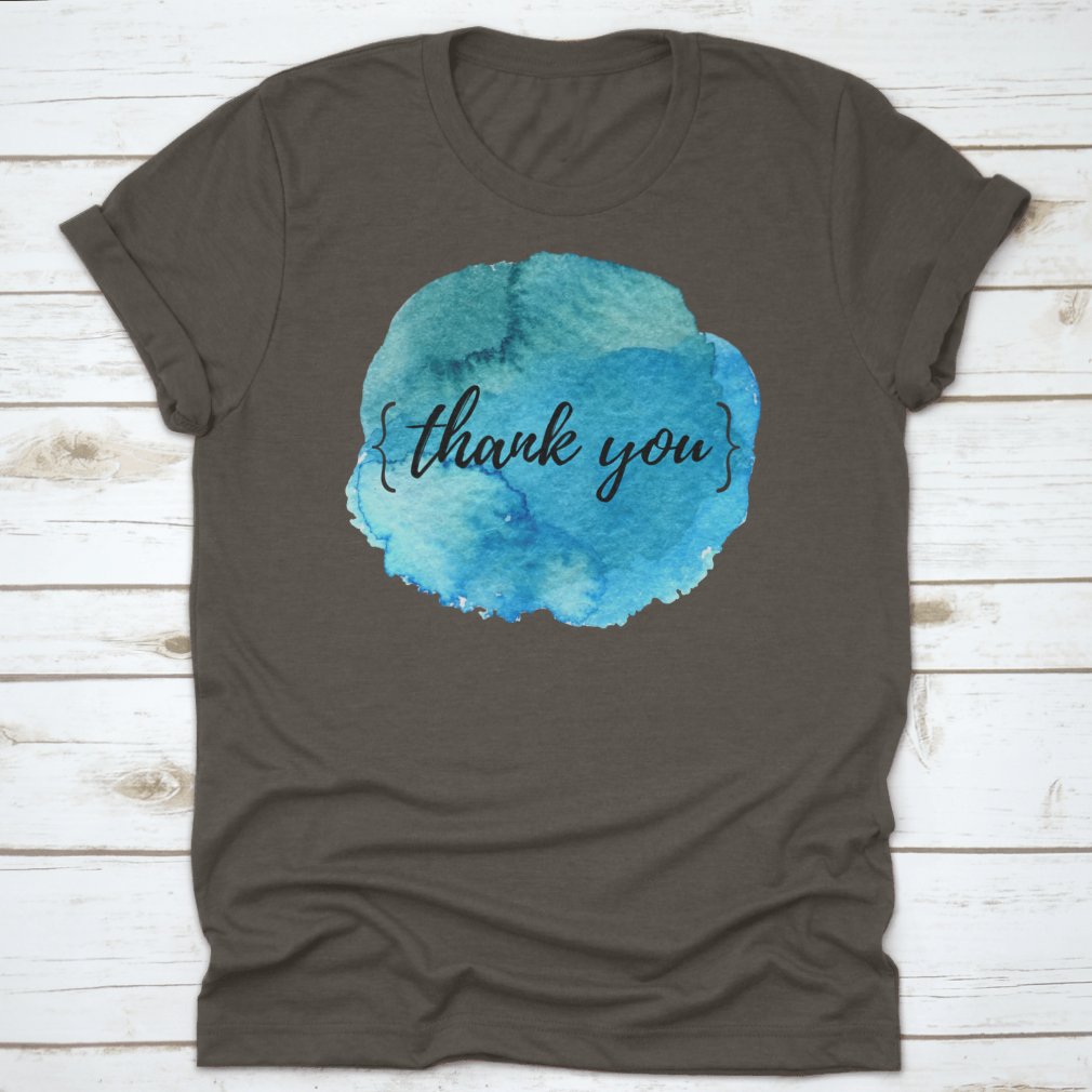 A stylish cotton t-shirt featuring a watercolor circle spot design with an inspirational quote, perfect for motivation.