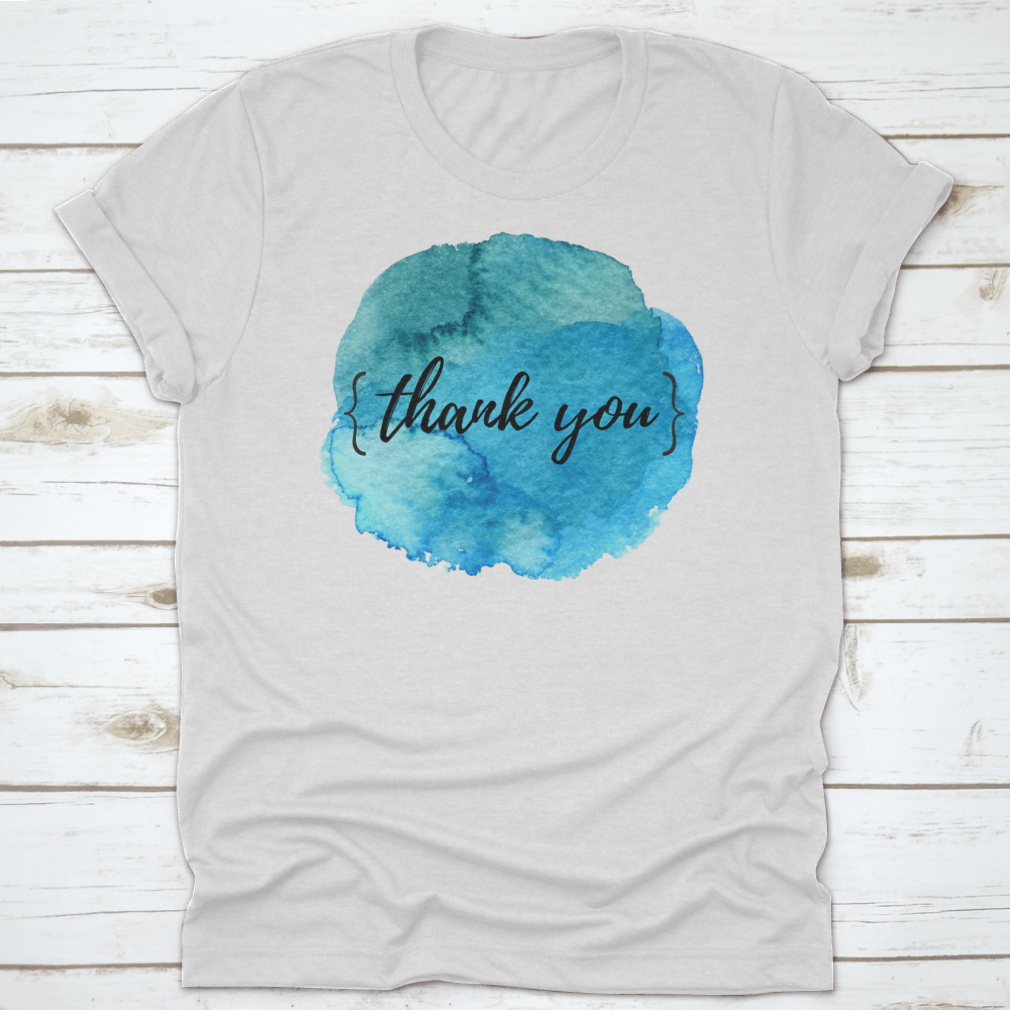 A stylish cotton t-shirt featuring a watercolor circle spot design with an inspirational quote, perfect for motivation.