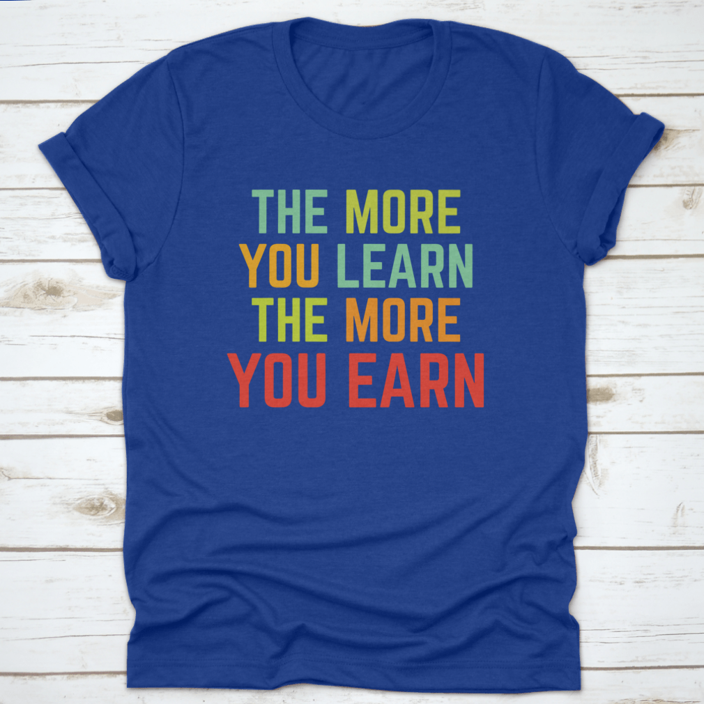 A comfortable and stylish t-shirt featuring the phrase 'The More You Learn', made from 100% cotton with a classic fit.