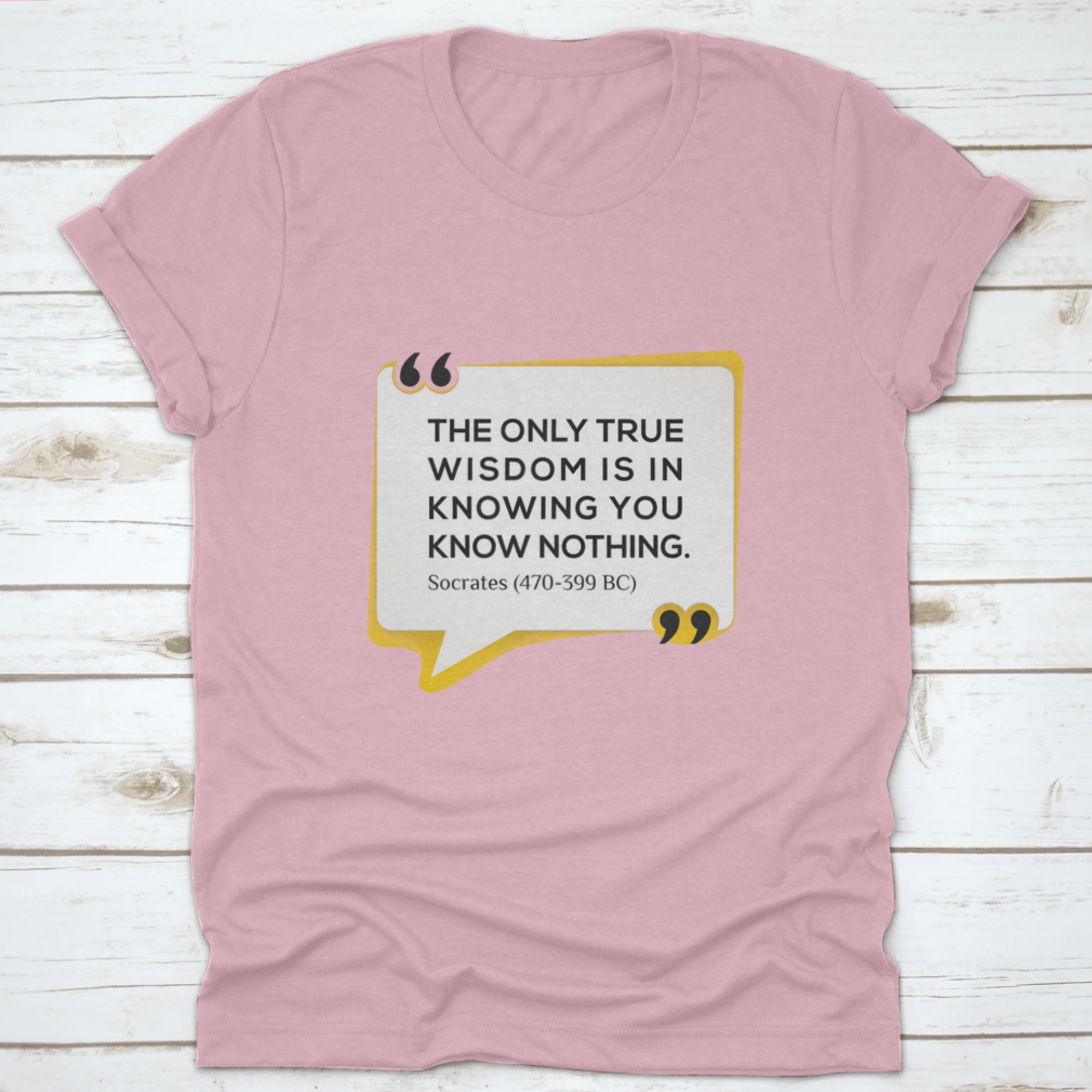 Inspirational T-shirt featuring the quote 'The Only True Wisdom Is In Knowing You Know Nothing', made from 100% cotton, displayed on a neutral background.