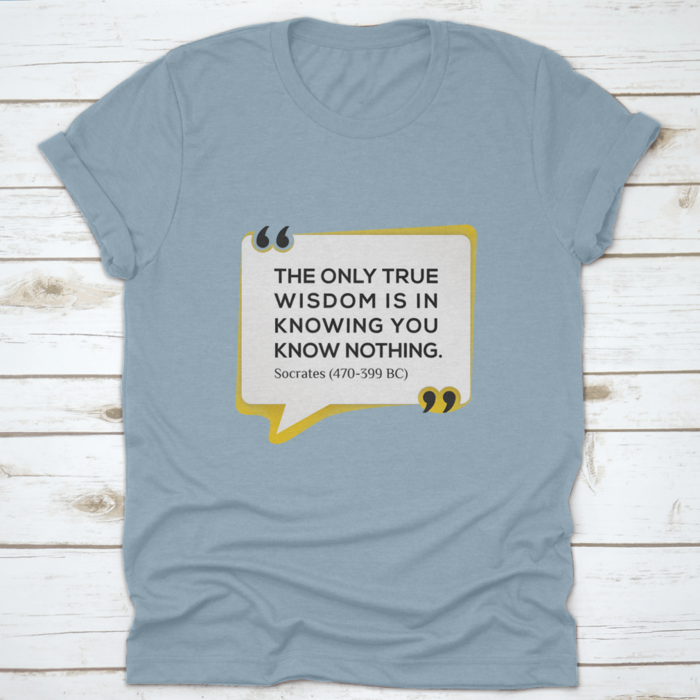 Inspirational T-shirt featuring the quote 'The Only True Wisdom Is In Knowing You Know Nothing', made from 100% cotton, displayed on a neutral background.