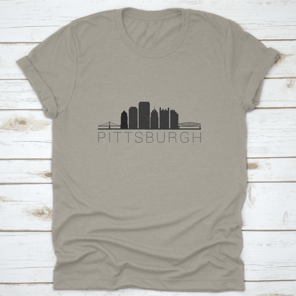 A stylish t-shirt featuring a skyline silhouette of a city, showcasing iconic landmarks in a modern design.