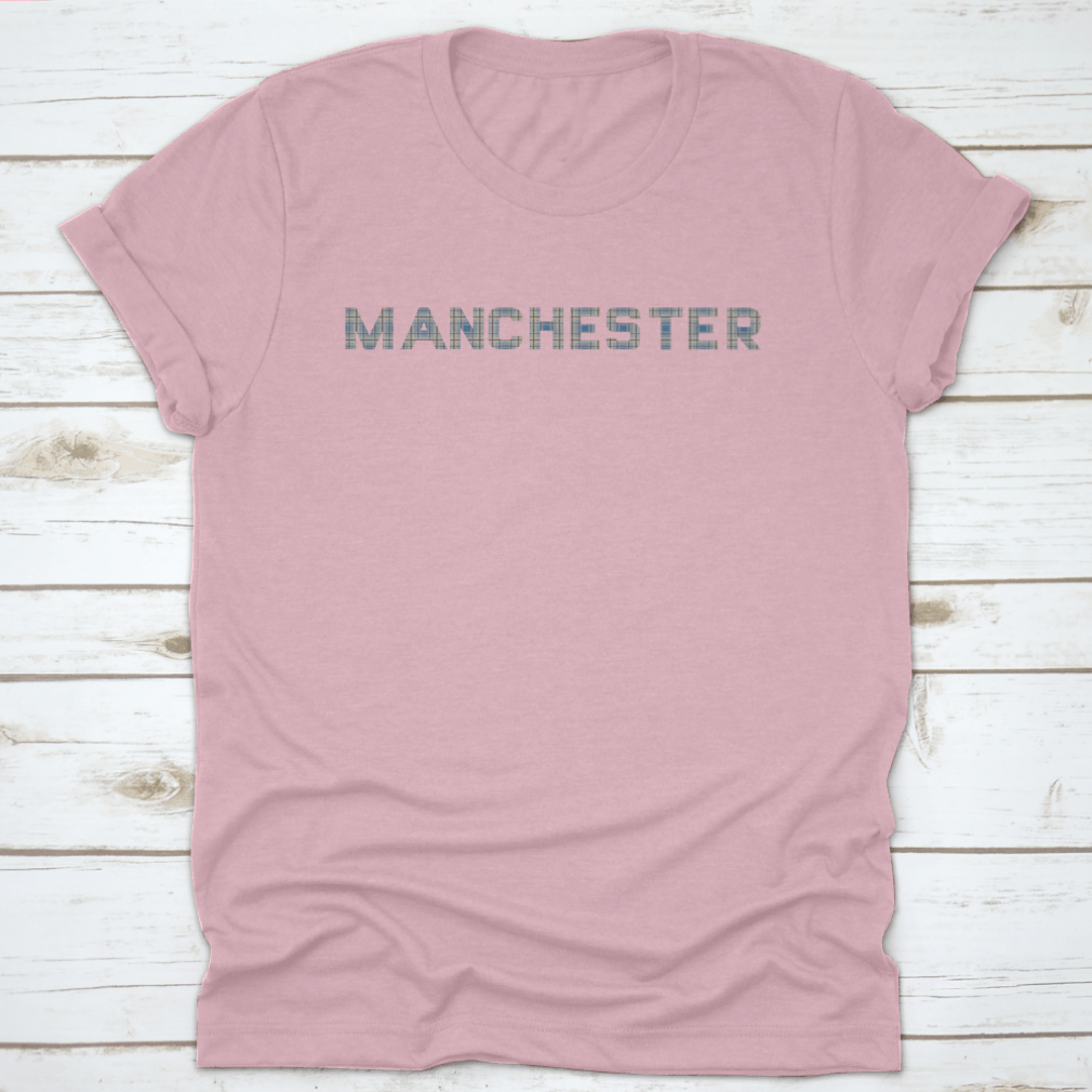 A stylish t-shirt featuring the word 'Manchester' designed with letters from the Manchester Tartan pattern, showcasing vibrant colors and a classic fit.