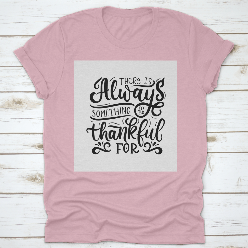 A comfortable T-shirt featuring the phrase 'There Is Always Something To Be Thankful For', made from 100% cotton, showcasing its classic fit and quality fabric.