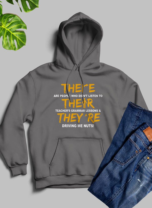 A stylish hoodie featuring the phrase 'There Their & They're' designed by top artists, showcasing a cozy fleece blend material.