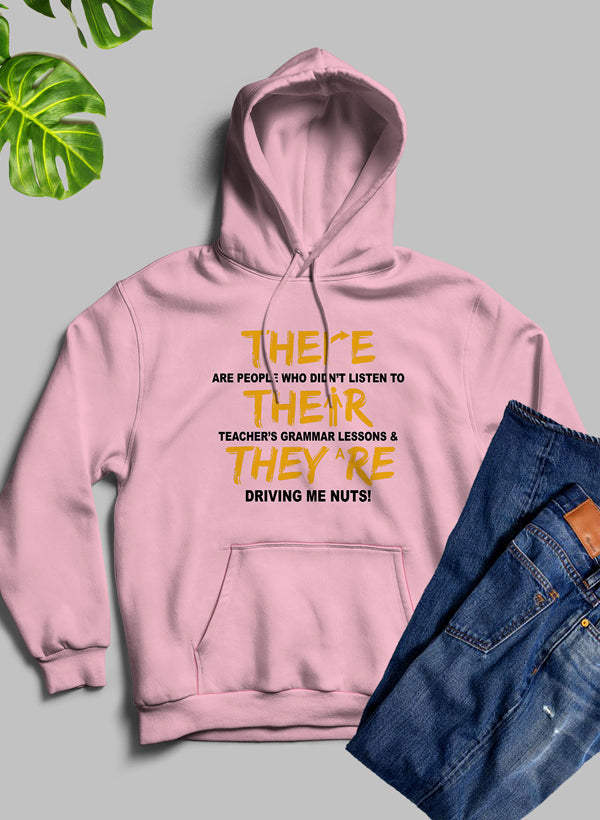 A stylish hoodie featuring the phrase 'There Their & They're' designed by top artists, showcasing a cozy fleece blend material.