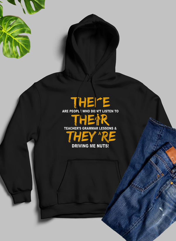 A stylish hoodie featuring the phrase 'There Their & They're' designed by top artists, showcasing a cozy fleece blend material.