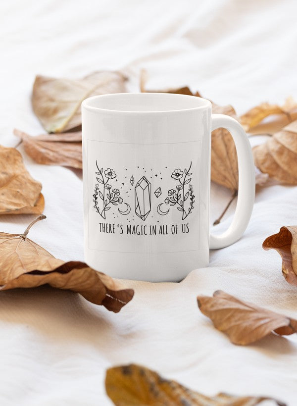 A stylish 11oz ceramic mug with a glossy finish, featuring the phrase 'There's Magic In All Of Us' and a sturdy handle.