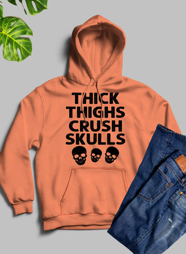 Thick Thighs Crush Skulls Hoodie featuring a unique artistic design, cozy fleece material, and adjustable hood.