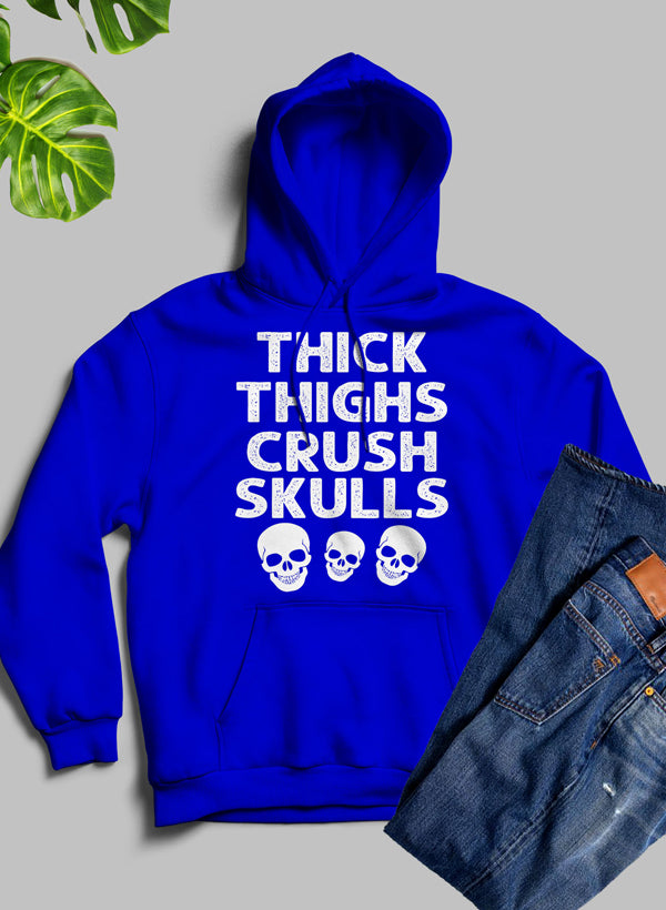 Thick Thighs Crush Skulls Hoodie featuring a unique artistic design, cozy fleece material, and adjustable hood.