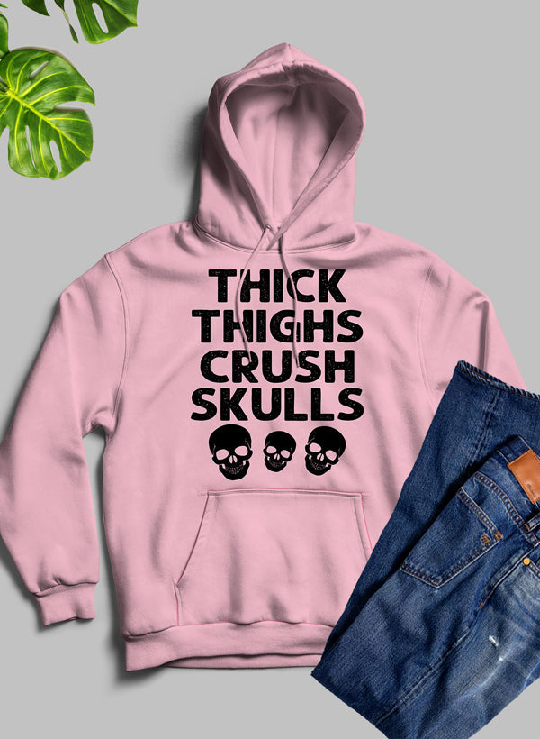 Thick Thighs Crush Skulls Hoodie featuring a unique artistic design, cozy fleece material, and adjustable hood.