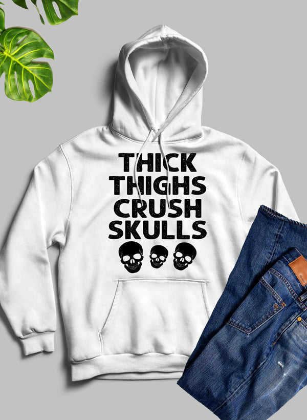 Thick Thighs Crush Skulls Hoodie featuring a unique artistic design, cozy fleece material, and adjustable hood.