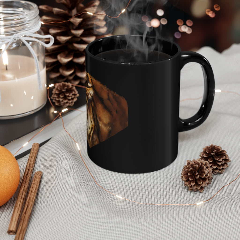 A sleek 11oz black ceramic mug with rounded corners and a C-handle, showcasing a full-wrap design for personalization.