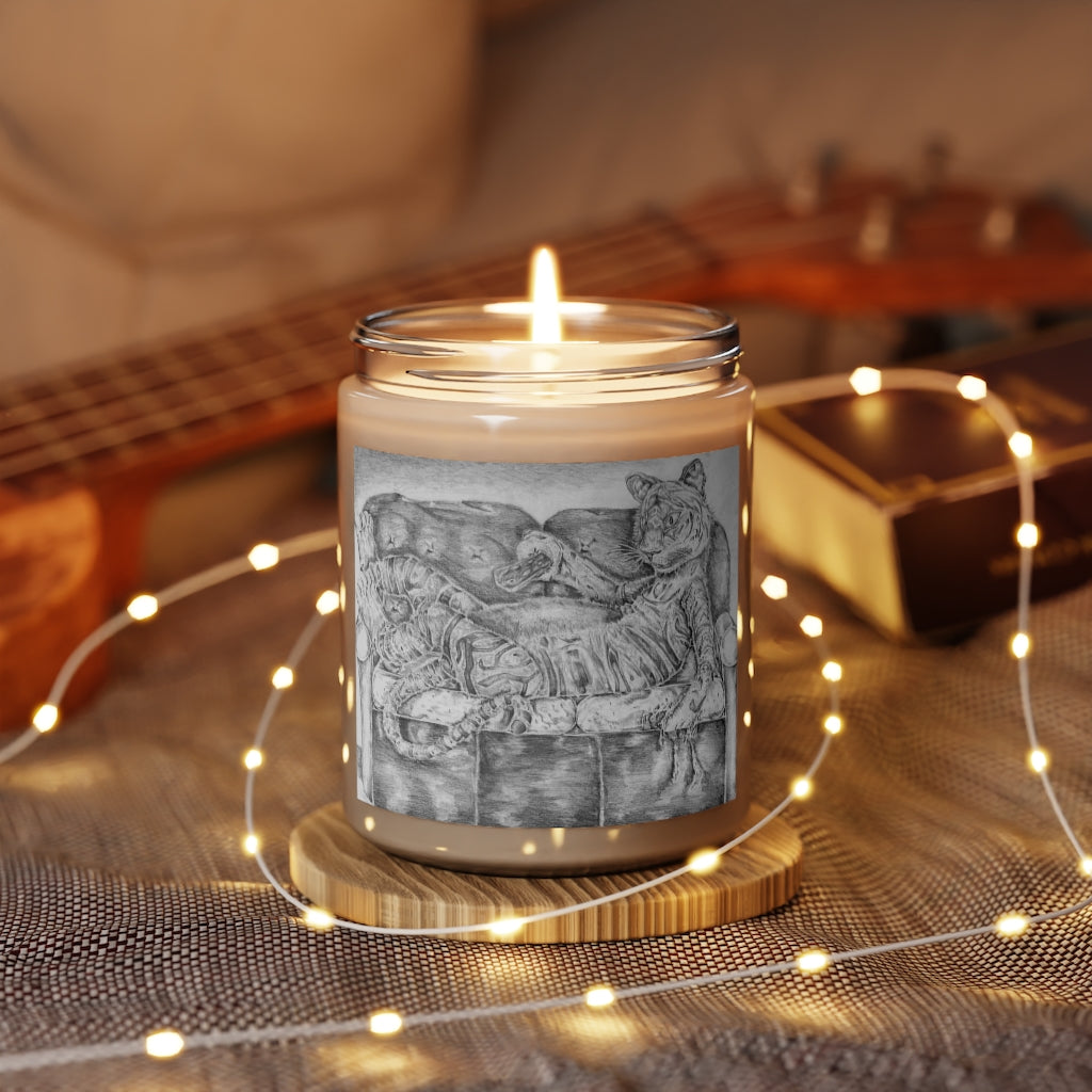 Tiger on a Couch Scented Candle in a glass container, featuring a permanent adhesive label, available in Cinnamon Stick and Vanilla scents.