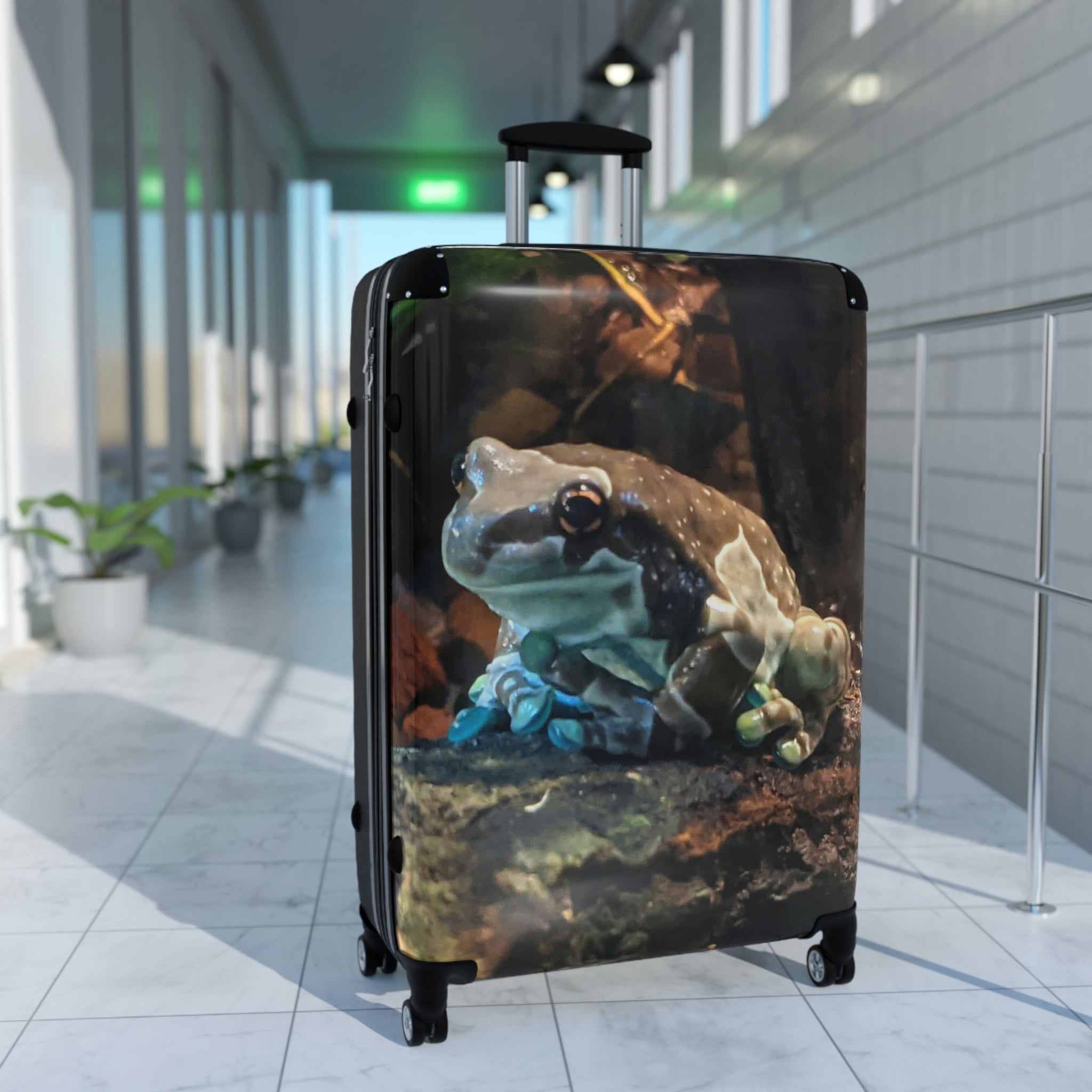 Toad Cabin Suitcase featuring a personalized design, lightweight polycarbonate front, and ABS back, with adjustable handle and 360° swivel wheels.