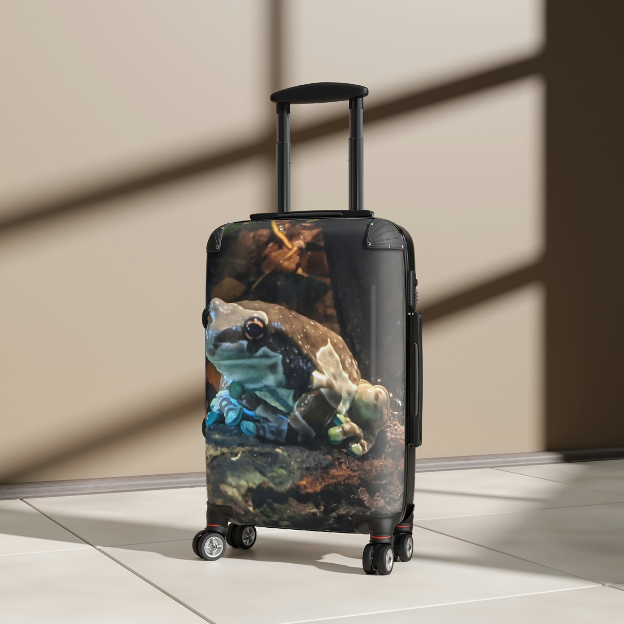 Toad Cabin Suitcase featuring a personalized design, lightweight polycarbonate front, and ABS back, with adjustable handle and 360° swivel wheels.