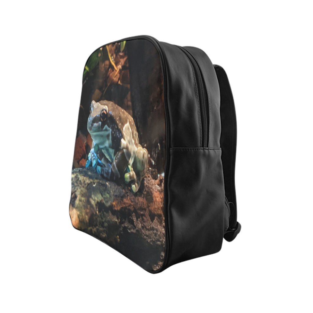 Toad School Backpack made of 100% PU leather with chocolate brown lining and padded back, featuring stylish print and inside pockets.