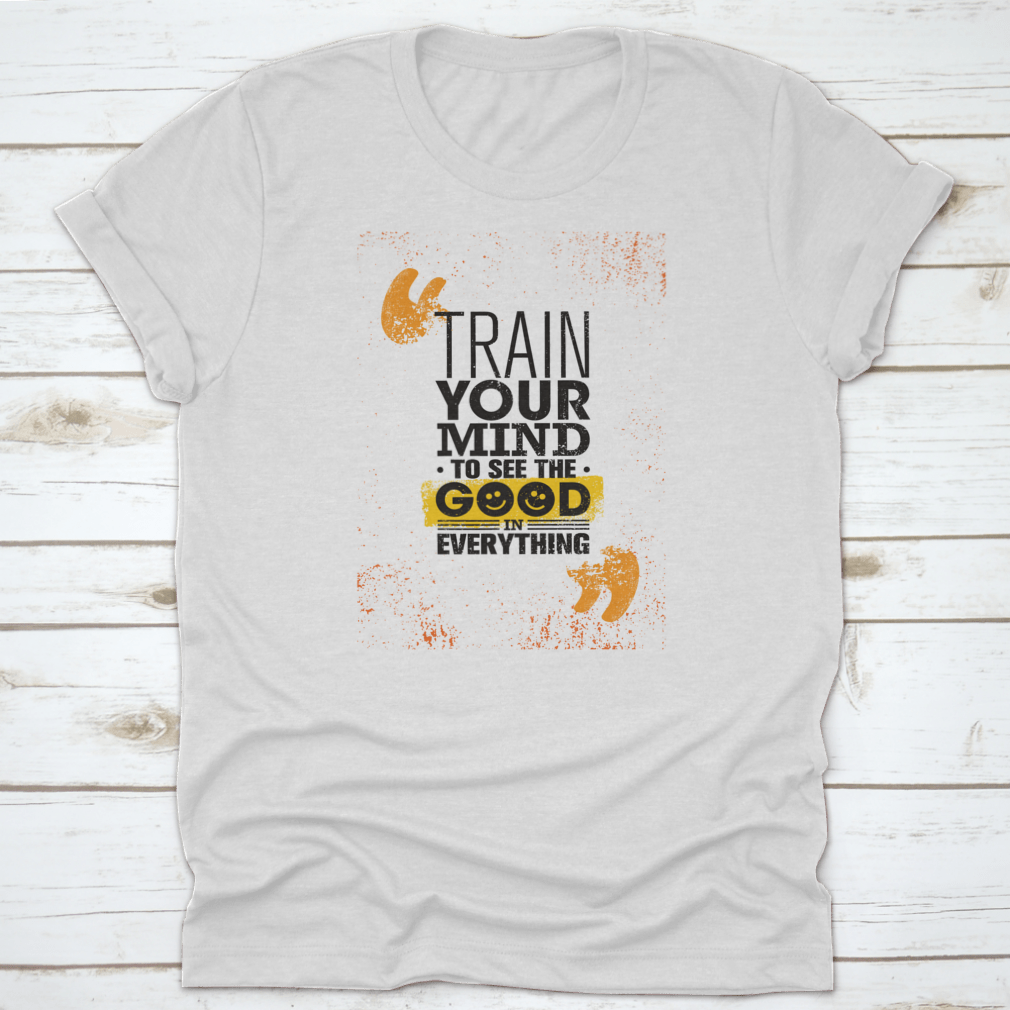 A comfortable cotton t-shirt featuring the inspiring phrase 'Train Your Mind To See The Good In Everything' in a stylish design.