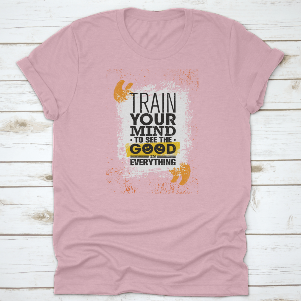 A comfortable cotton t-shirt featuring the inspiring phrase 'Train Your Mind To See The Good In Everything' in a stylish design.