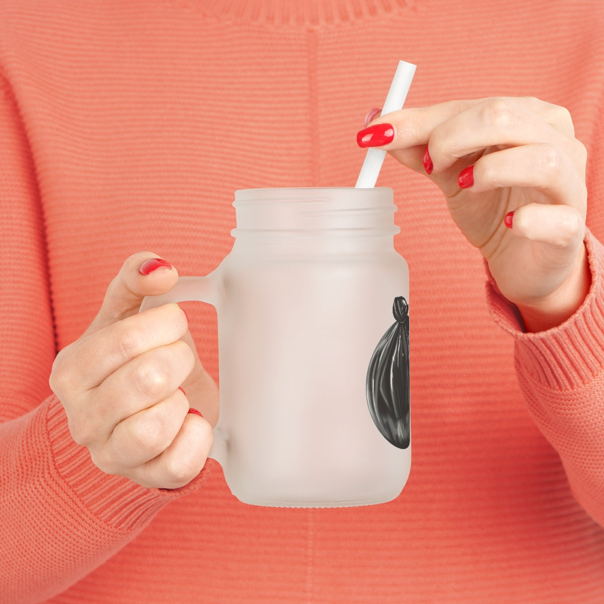 A stylish frosted glass mason jar with a straw and lid, perfect for drinks.