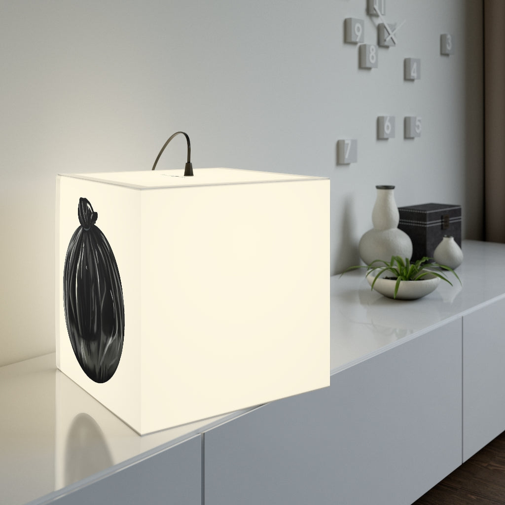 A stylish Trash Bag Personalized Lamp in a cube shape, showcasing unique designs, perfect for indoor decoration.