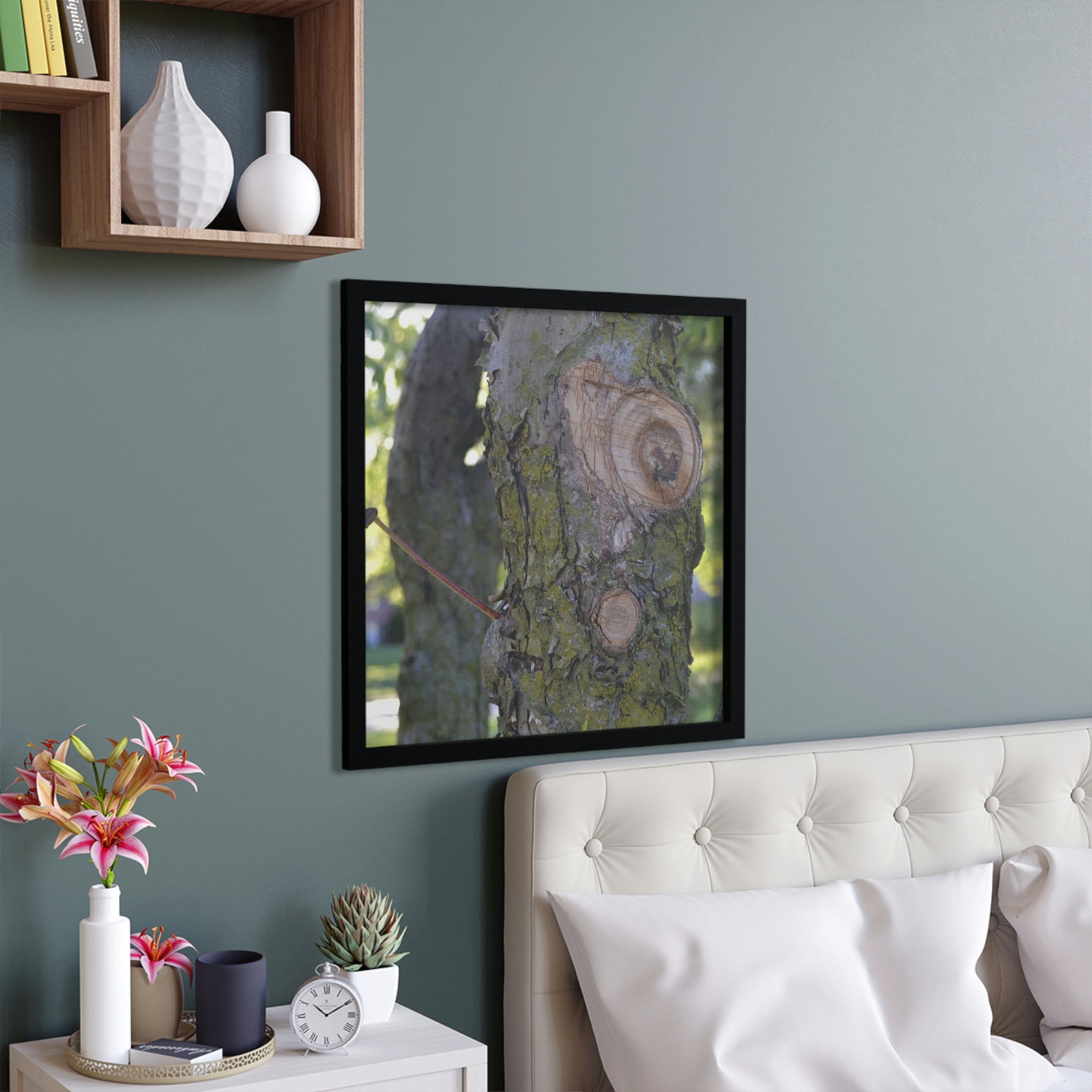 A beautifully framed poster featuring a tree design, showcasing a hand-crafted wooden frame and vibrant colors.