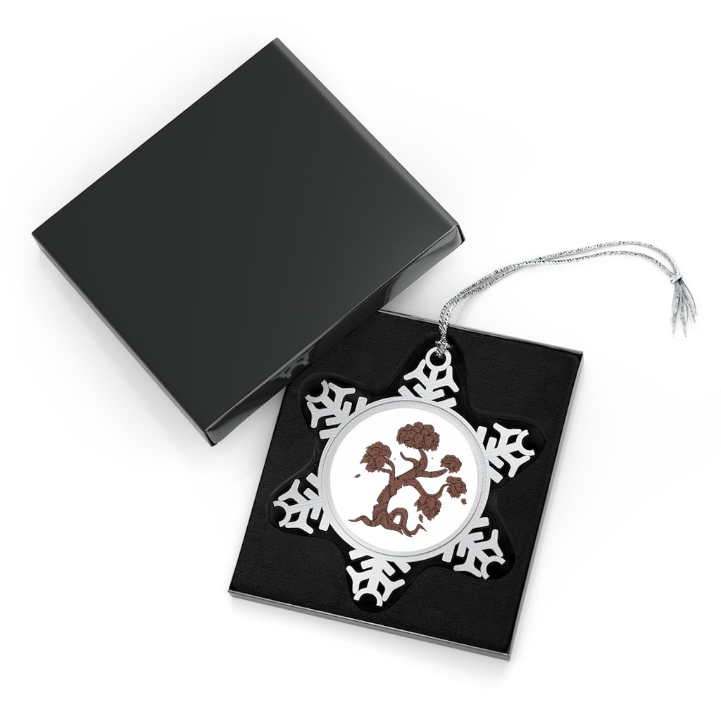 A beautifully crafted Tree Pewter Snowflake Ornament with intricate details and a silver-toned hanging string, perfect for holiday decor.