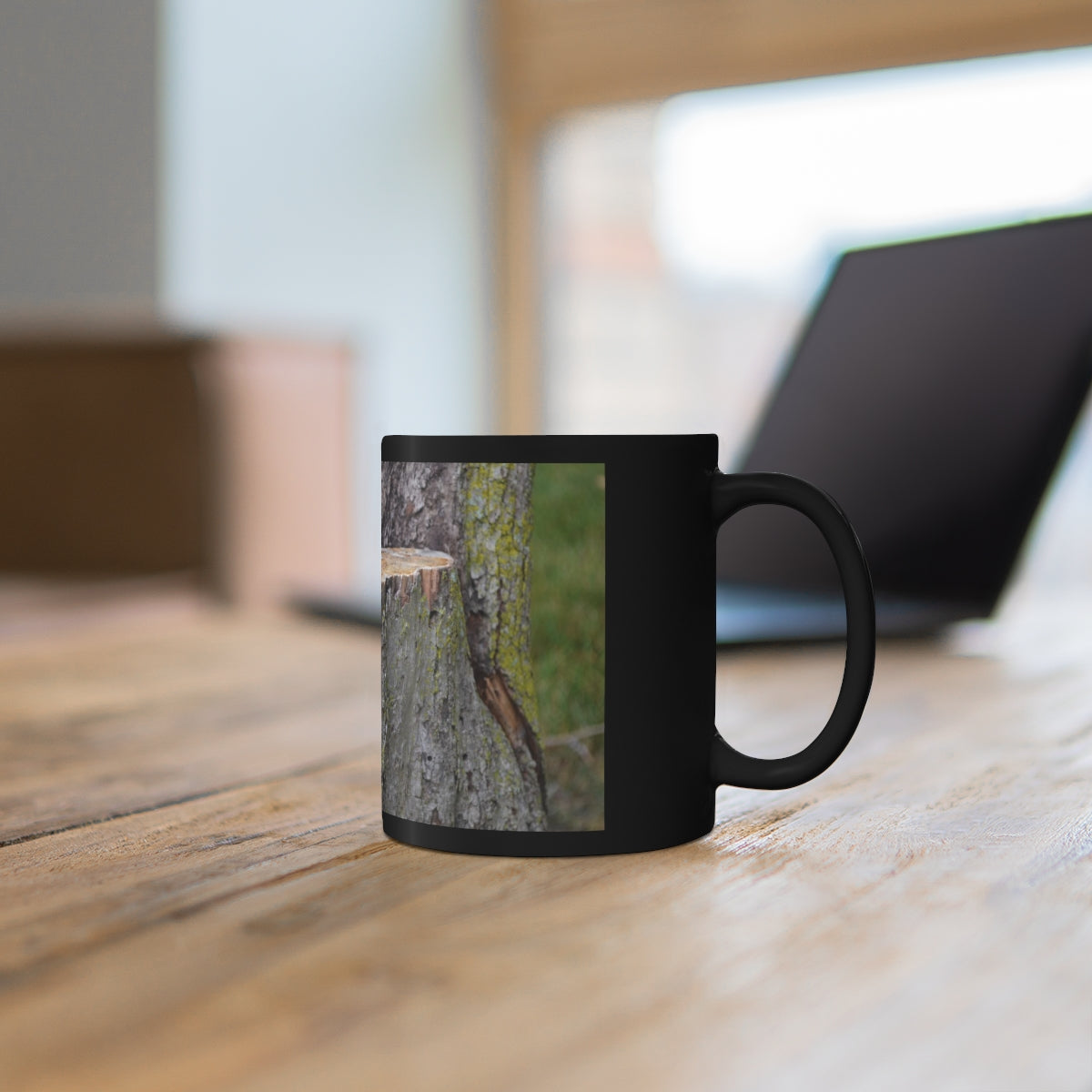 Tree Stump 11oz Black Mug with C-handle, showcasing a sleek black ceramic design, perfect for coffee, tea, or hot chocolate.