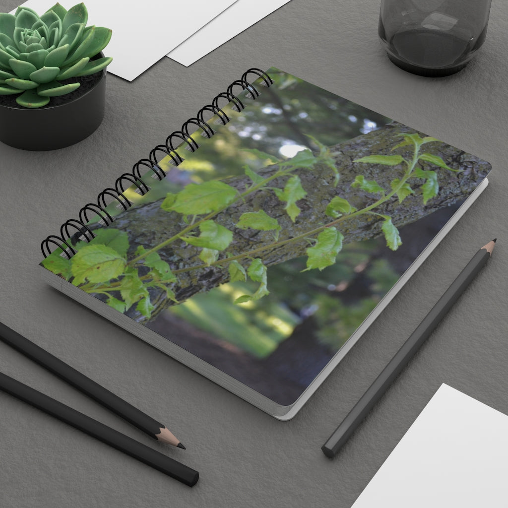 Tree Stump and Green Leaves Spiral Bound Journal with glossy cover and lined pages, perfect for writing and journaling.