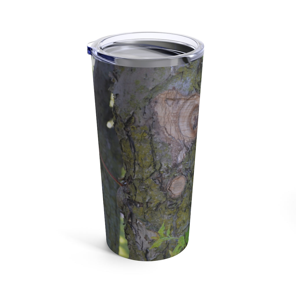 20oz stainless steel tumbler featuring a tree stump and green leaves design, perfect for travel and outdoor use.