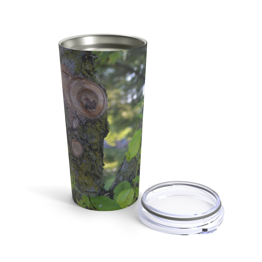 20oz stainless steel tumbler featuring a tree stump and green leaves design, perfect for travel and outdoor use.