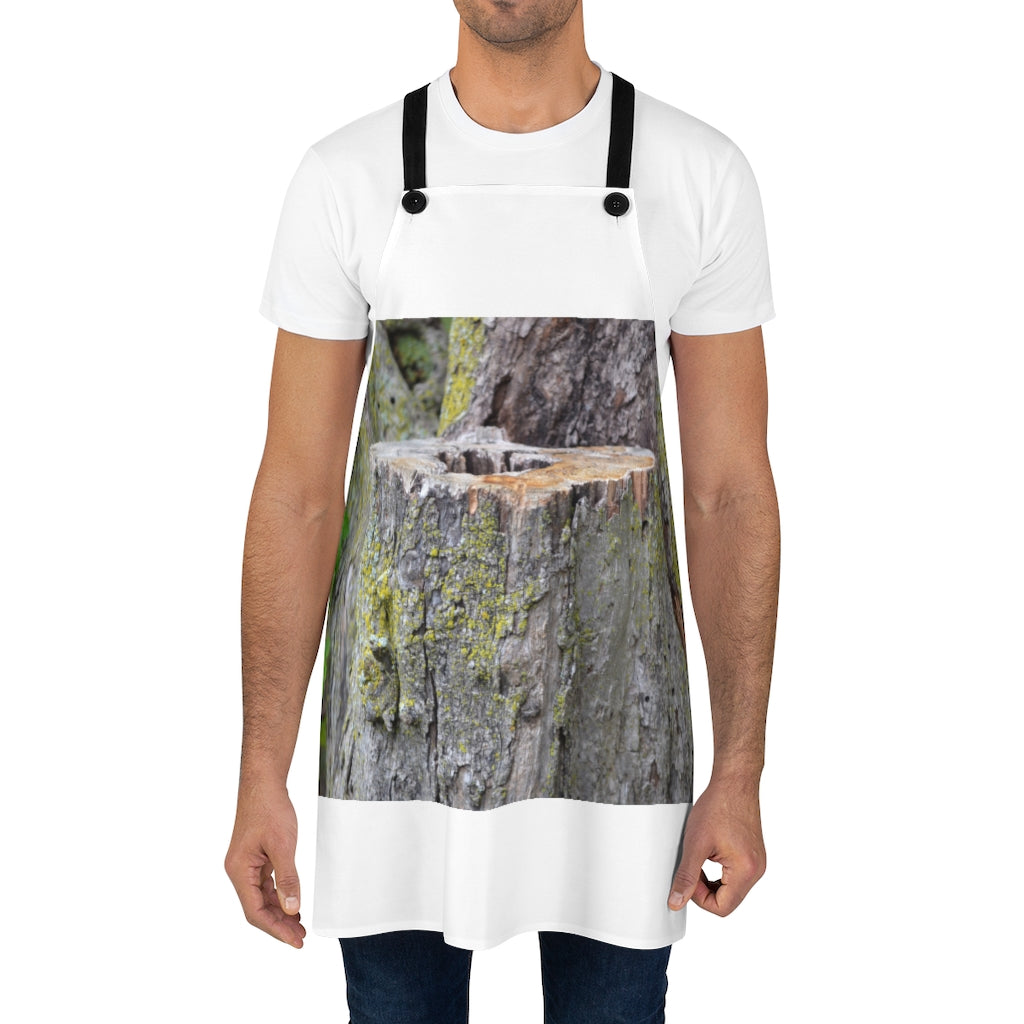 Tree Stump Apron featuring a unique tree stump design, made from durable polyester with black detachable twill straps.