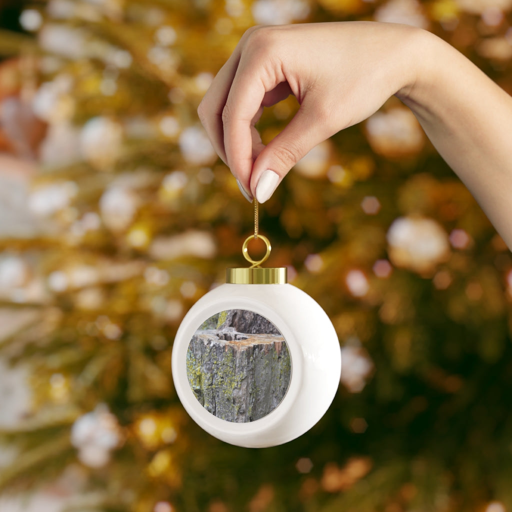 A beautifully designed 3-inch Tree Stump Christmas Ball Ornament with a glossy finish and gold ribbon, featuring a vintage style and customizable metal insert.