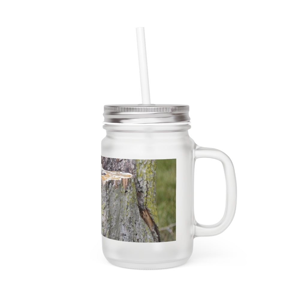 A stylish Tree Stump Mason Jar made of frosted glass, featuring a straw and lid, perfect for personalized drinks.