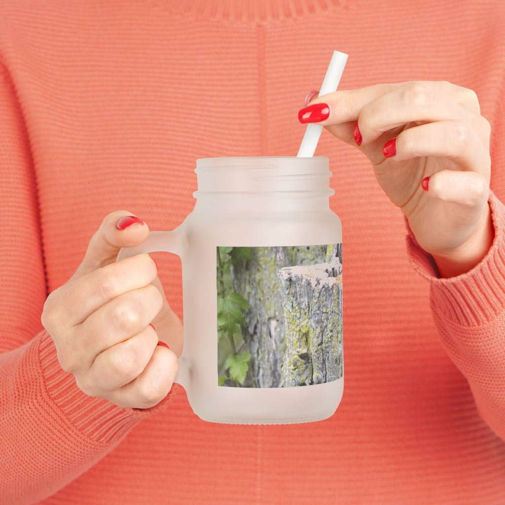 A stylish Tree Stump Mason Jar made of frosted glass, featuring a straw and lid, perfect for personalized drinks.