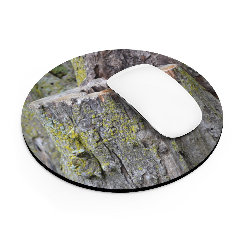 Tree Stump Mouse Pad featuring a vibrant tree stump design with a non-slip rubber bottom, available in round and rectangular shapes.