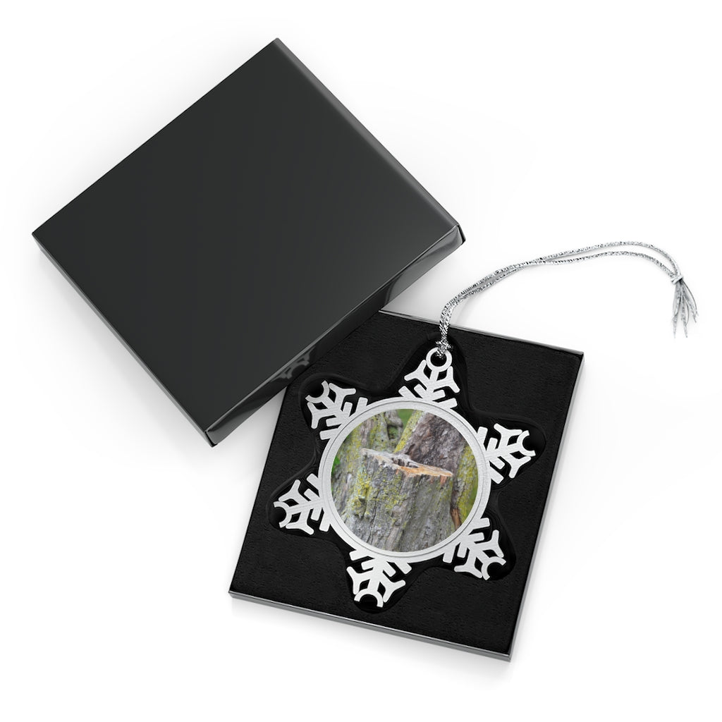 Tree Stump Pewter Snowflake Ornament with silver-toned hanging string, showcasing intricate snowflake design.