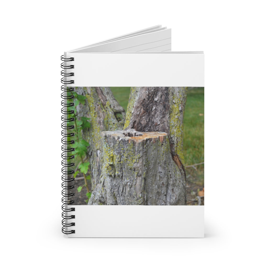 Tree Stump Spiral Notebook with ruled line pages and a printed cover featuring a tree stump design.