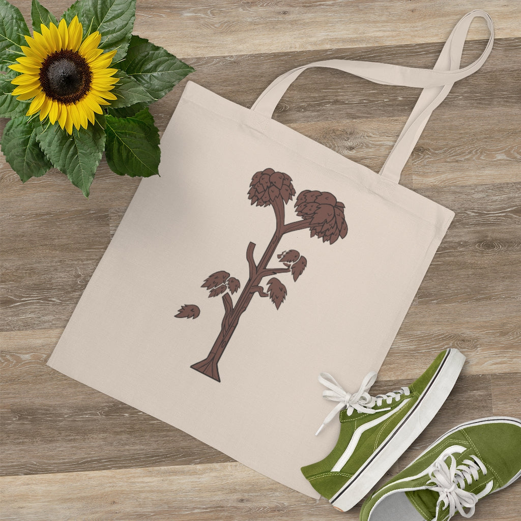 A stylish Tree Tote Bag made of 100% cotton, featuring long handles and cross stitching for durability, available in multiple colors.